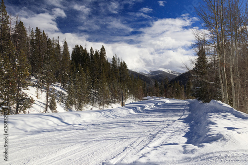 Wintry trail through snow in Rocky Mountain National Park, Colorado