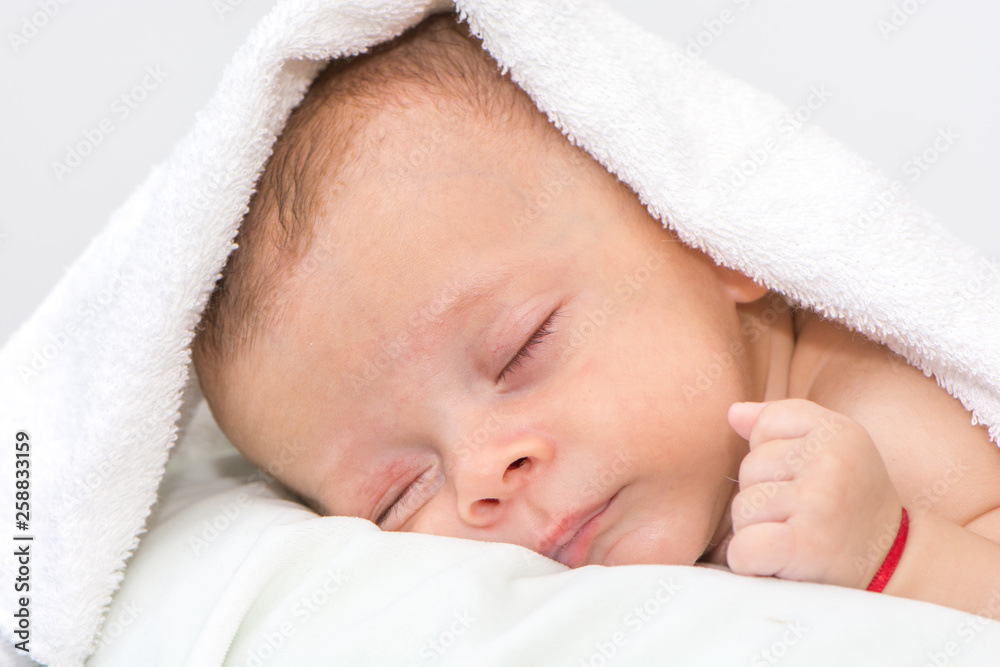picture of a newborn baby curled up sleeping on a blanket picture of a newborn baby curled up sleeping on a blanket