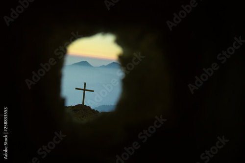 Empty tomb with cross symbol for Jesus Christ is risen