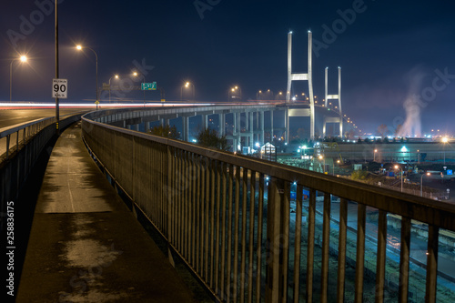 The Alex Fraser bridge at night with surrounding industry.
