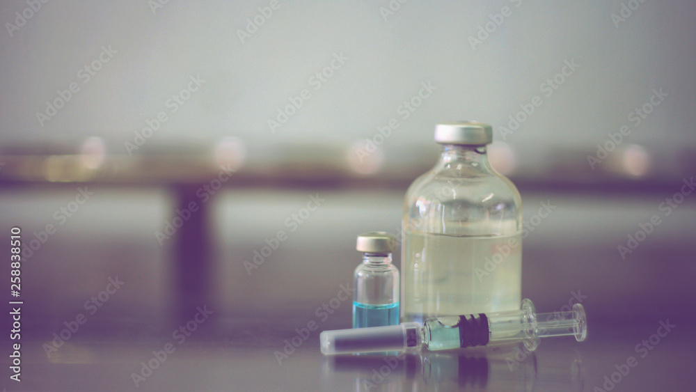 Vaccine vial dose flu shot drug needle syringe,medical concept vaccination hypodermic injection treatment disease care hospital prevention immunization illness disease baby background.