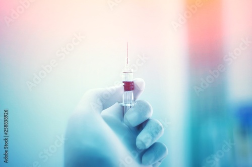 Vaccine vial dose flu shot drug needle syringe,medical concept vaccination hypodermic injection treatment disease care hospital prevention immunization illness disease baby background.
