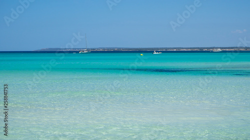 Colonia Sant Jordi, Ses Salines, Spain. Amazing view of the boats with a turquoise sea close to the charming beach of Es Trencs. It has earned the reputation of Caribbean beach of Mallorca © Matteo Ceruti