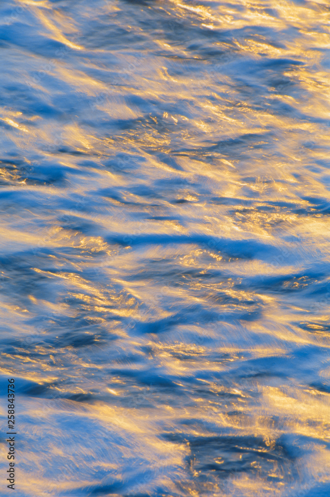 Backlit water in motion Backlit water in motion
