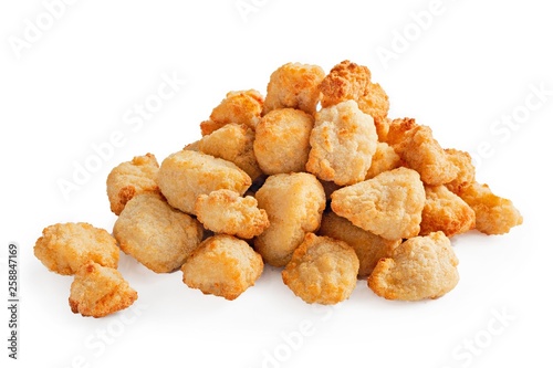 Fried chicken pieces on white background