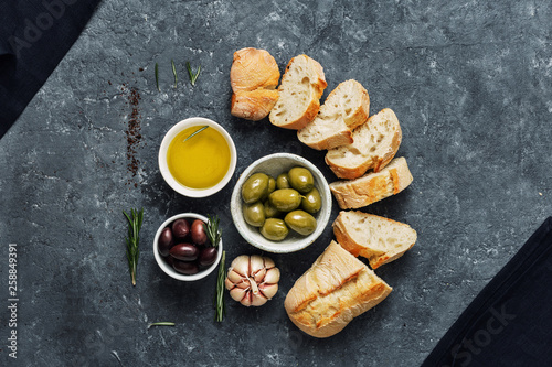 Italian food Cooking Italian bruschetta Olives fresh baguette slices olive oil garlic rosemary