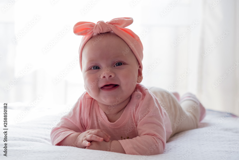 Beautiful newborn baby girl with pink headband Beautiful newborn baby girl with pink headband