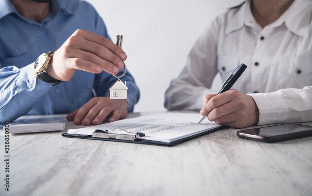 Real estate agent with customer in office. Real estate concept