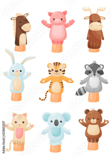 Collection of dolls on hand on white background.