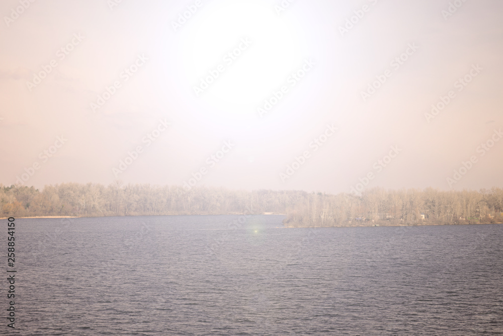 Fototapeta premium Fabulous sunset over the river. Spring evening landscape.
