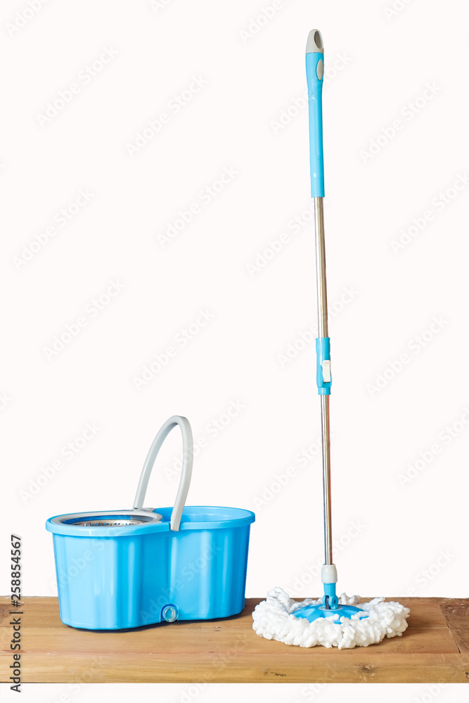 Floor cleaning with mob and bucket on background. Floor cleaning with mob and bucket on background.