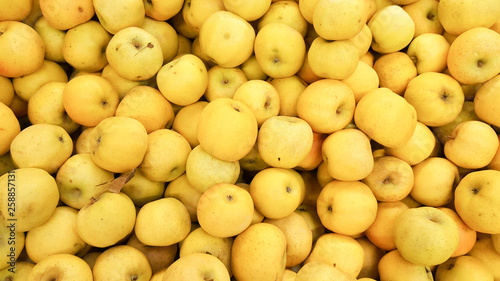 Fresh picked yellow golden delicious apples background in the harvest season