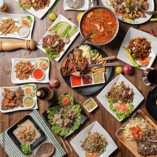 Set of thai food on table, Steak, Fish, Vegetables and Spices on a wooden