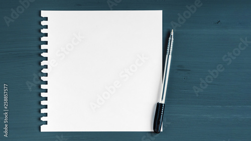 Blank sheet of paper on wooden background