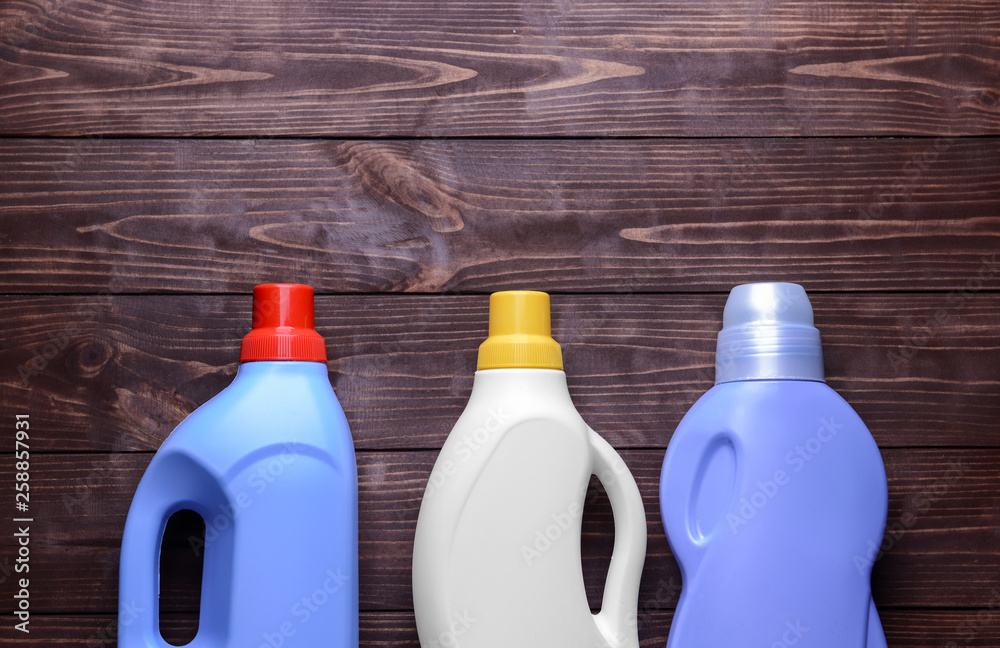 Set of detergents on wooden background Set of detergents on wooden background