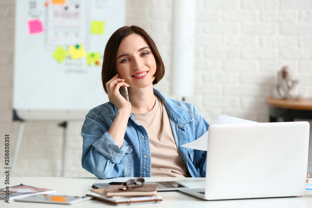 Female designer working in office Female designer working in office
