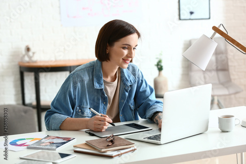 Female designer working in ...