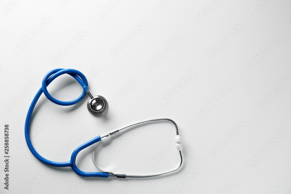 Medical stethoscope on white background