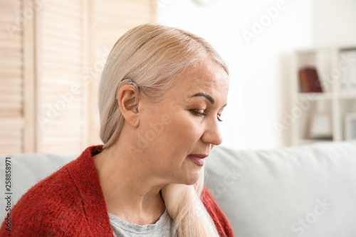 Mature woman with hearing a...