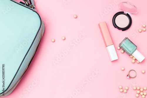 Beauty products and handback on pink background. Copy space photo