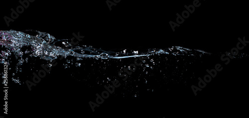 water waves splash and bubbles isolated on black background