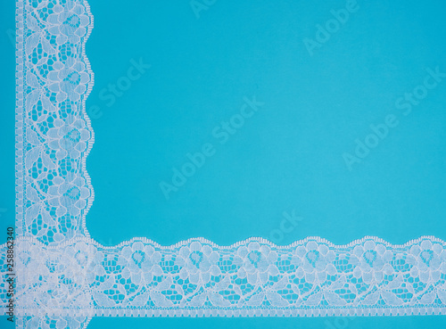 White lace on a blue background photo