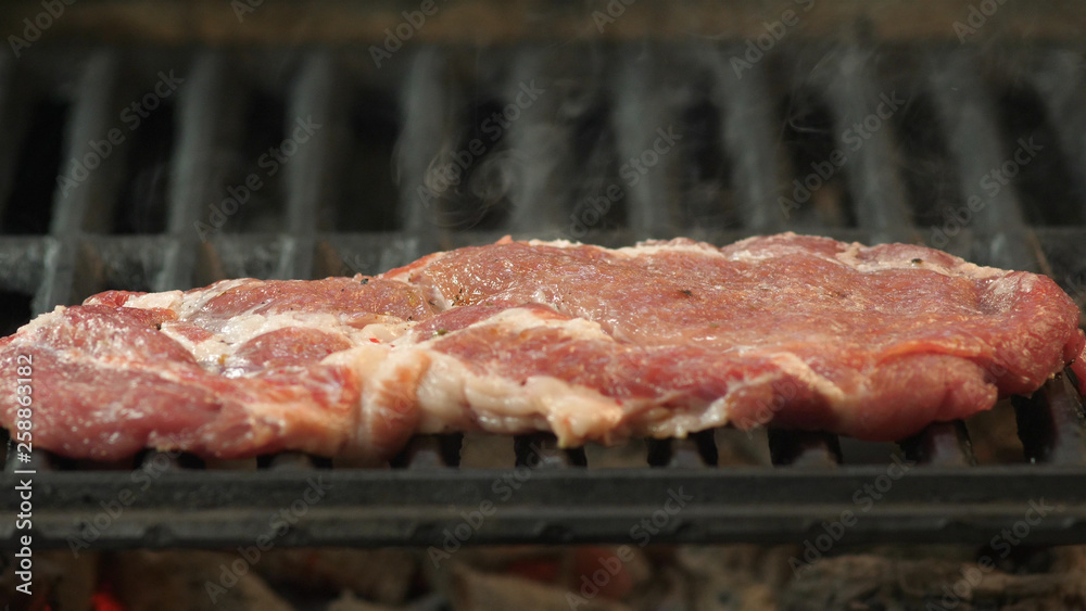 Barbecue beef steak on grill close up