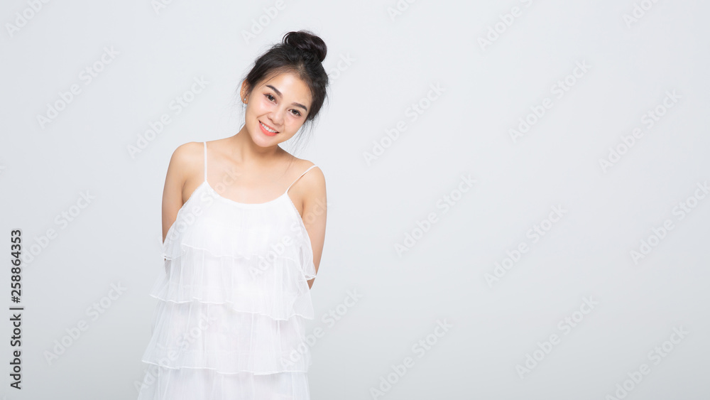 Beautiful smiling woman with clean skin, natural make-up, and white teeth on white background Beautiful smiling woman with clean skin, natural make-up, and white teeth on white background