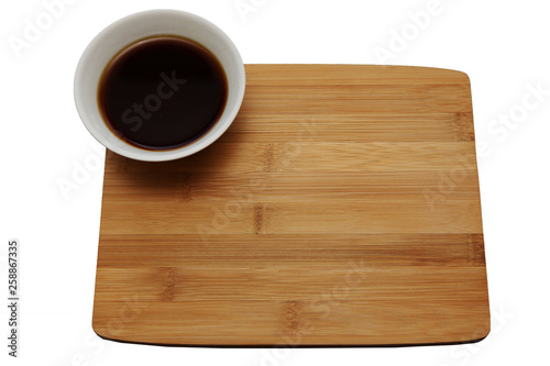 wooden Board with soy sauce isolated on white background