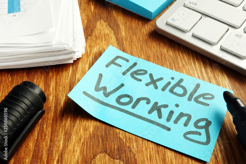Bild auf Leinwand Flexible working policy concept. Piece of paper on table.