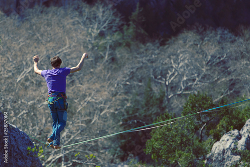 Wallpaper Mural Man balancing on the rope concept of risk taking and challenge. Torontodigital.ca
