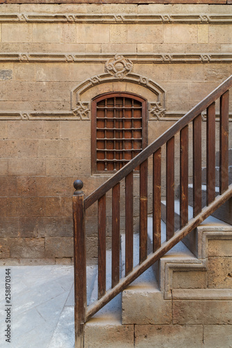 Wooden window and staircase with wooden balustrade leading to historic Beit El Set Waseela building (Waseela Hanem House), Old Cairo, Egypt photo