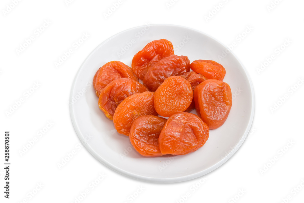 Dried apricots on the white saucer