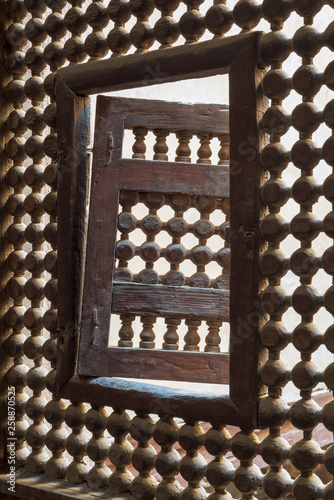 Wooden latticed window (Mashrabiya) with one small swinging sash, Zeinab Khatoun historic house, Old Cairo, Egypt photo