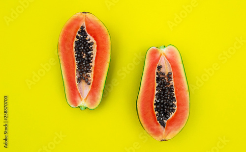 papaya on yellow backgroudd photo