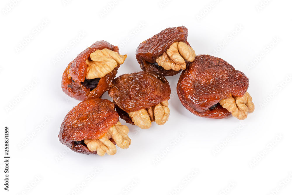 Dried apricots stuffed with walnuts and raisins close-up Dried apricots stuffed with walnuts and raisins close-up