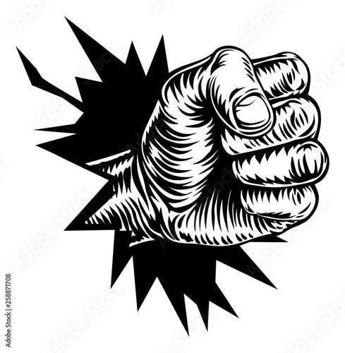 A fist hand breaking throug...