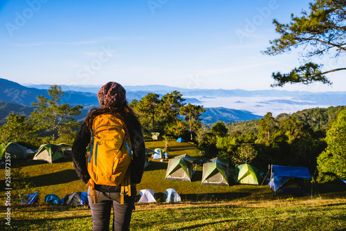 Young woman Tourists with backpacks Travel nature landscape view on the mountain, Backpacker Camping Hiking Journey Travel Trek Concept.