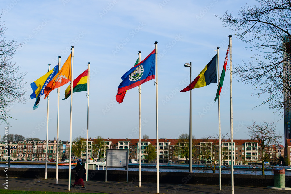 Flags of European states on flagpoles against the background of a cloudy sky. Flags of European states on flagpoles against the background of a cloudy sky.
