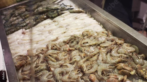 Big row shrimps on ice in Bangkok food court, Thailand photo