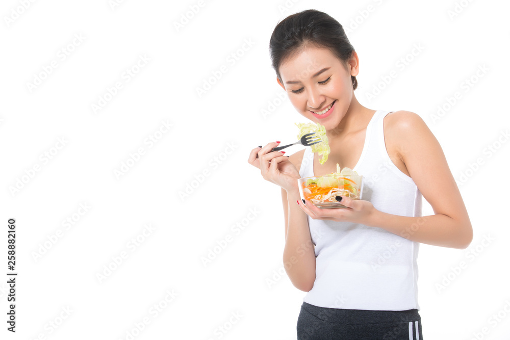 Portrait of a lovely pretty girl eating fresh salad from a bowl isolated over white background Portrait of a lovely pretty girl eating fresh salad from a bowl isolated over white background