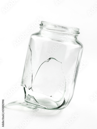 A fragment of one glass jar damaged cracked and cracked, splinters on a white background close-up.