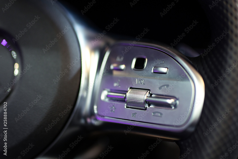 Detail on some buttons on a steering wheel Detail on some buttons on a steering wheel