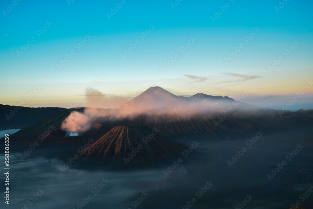 Beautiful colorful sunrise over Mount Bromo and wild island in Mount Bromo National Park