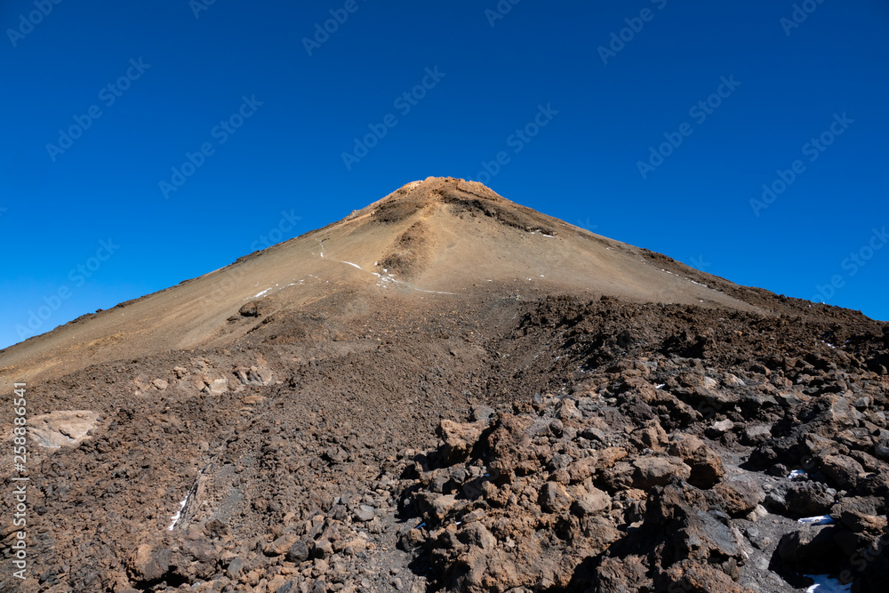 Teide volcano iconic crater against clear blue sky