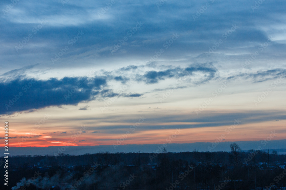 Beautiful winter dawn. Sunlight through the clouds in the morning in winter. Beautiful winter dawn. Sunlight through the clouds in the morning in winter.