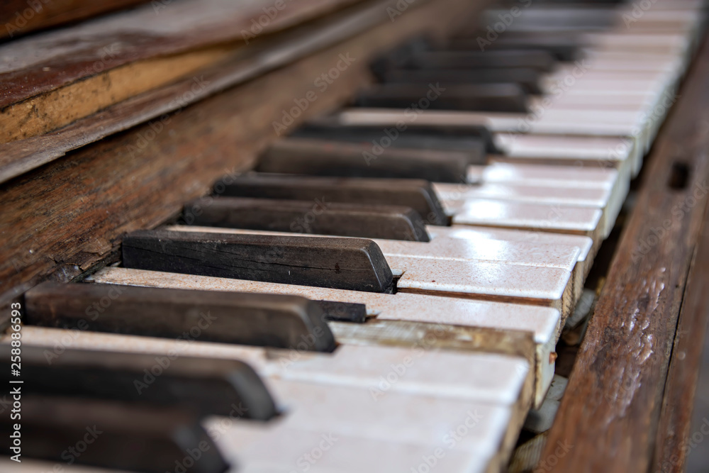 Dirty cracked keys of the old piano close-up Dirty cracked keys of the old piano close-up
