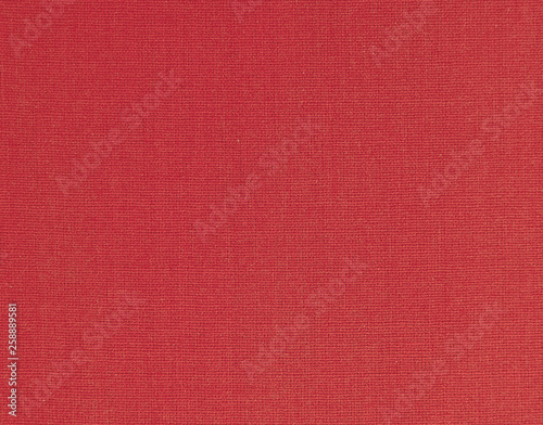 Textured background of red natural textile 