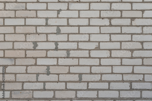 The brick texture, wall, with cracks and scratches