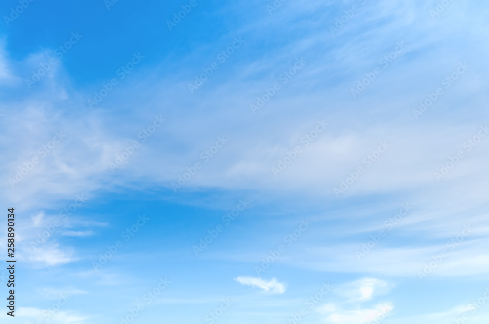 background of blue sky with white soft clouds